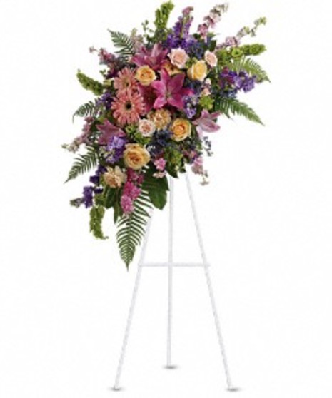 Sympathy spray of pink roses, larkspur, asiatic lilies, gerberas and more. 