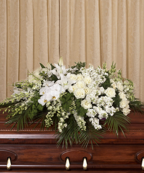Casket spray of all white roses, orchids, lilies and more.