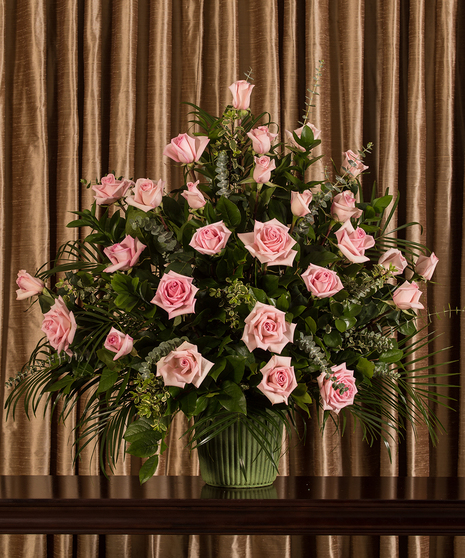 Funeral arrangement of pink roses. 