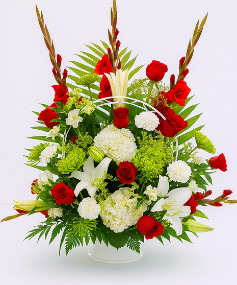 Sympathy arrangement of red and white flowers. 