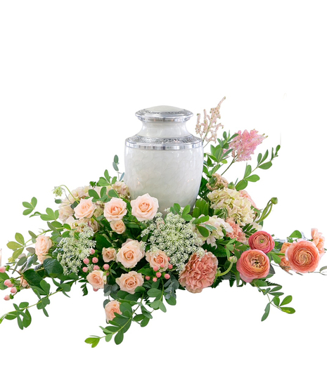 Sympathy arrangement of white calla lilies and roses to accompany an urn, guest book or photograph. 